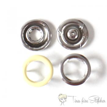 Set of 10 open 9,5mm Jersey snaps in the colour light yellow