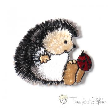 Small hedgehog with ladybird embroidery application