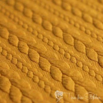 0,5 meter Jacquard knitted fabric with plait pattern ochre