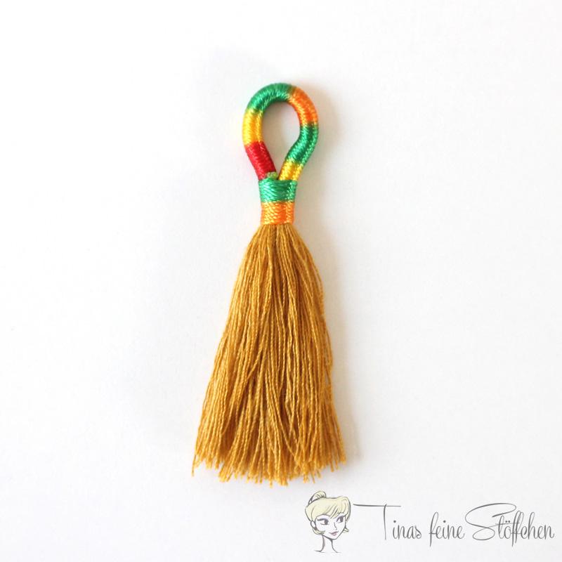 Beautiful handmade tassel made of cotton in ocker